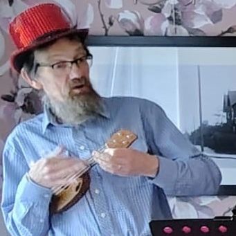 Eric in action with his smallest uke.