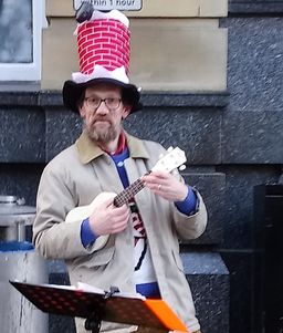 Eric, posing in busking gear and 'Santa in chimney' hat.